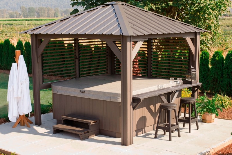 The side view of a Semi Enclosed Arctic Spas Gazebo Sienna with a hot tub