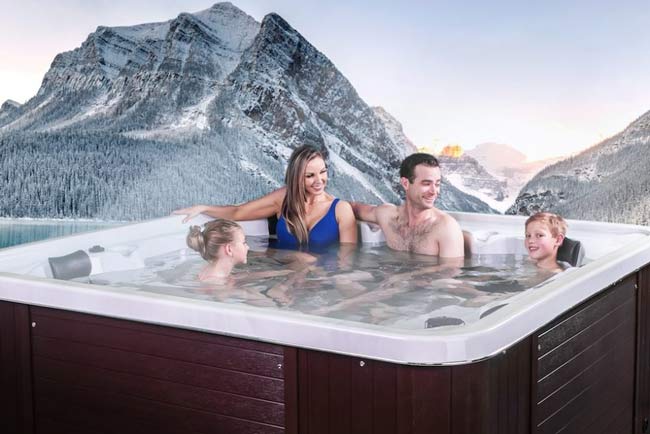 man in an Otter Arctic Spas hot tub